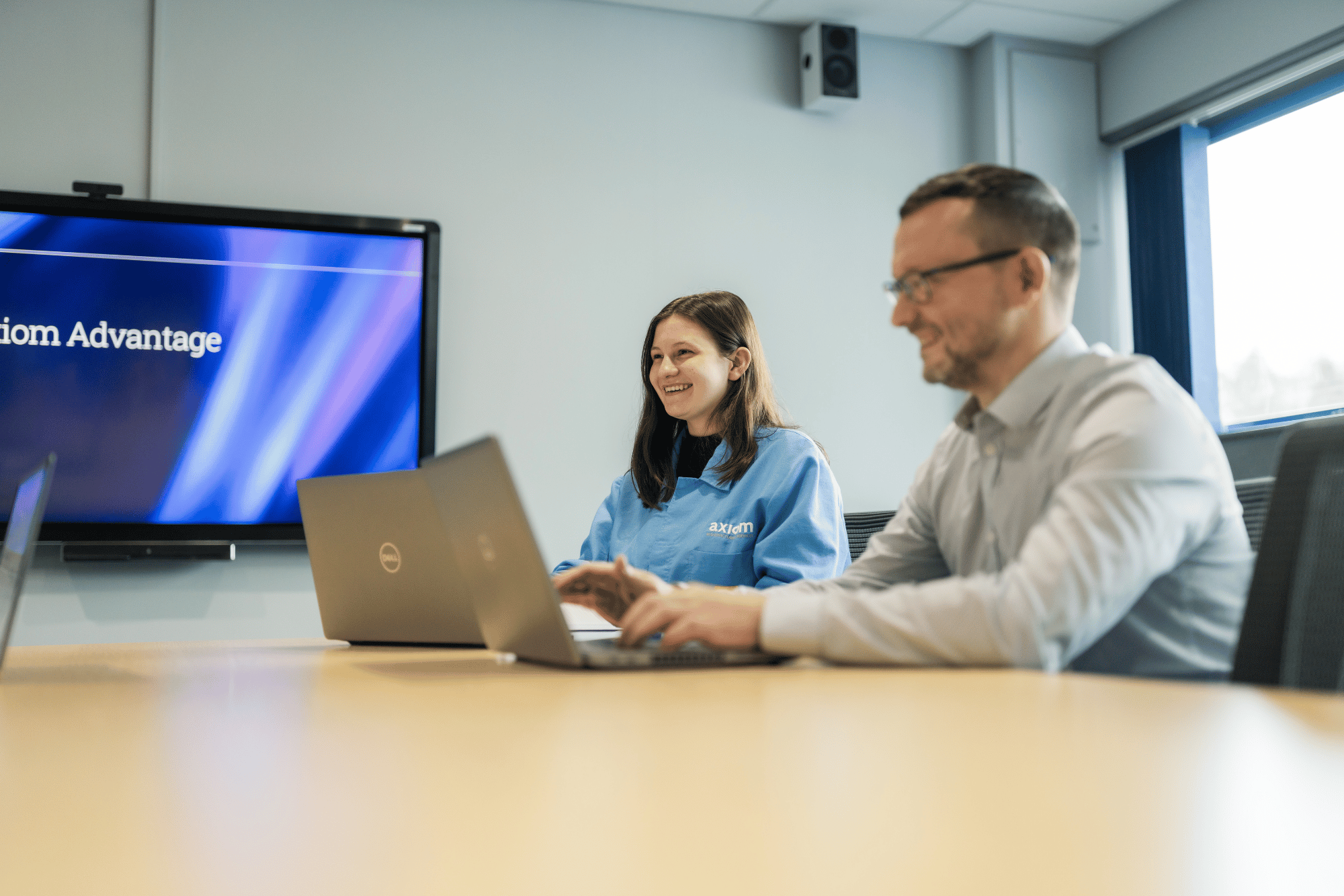 Board room man and woman.png